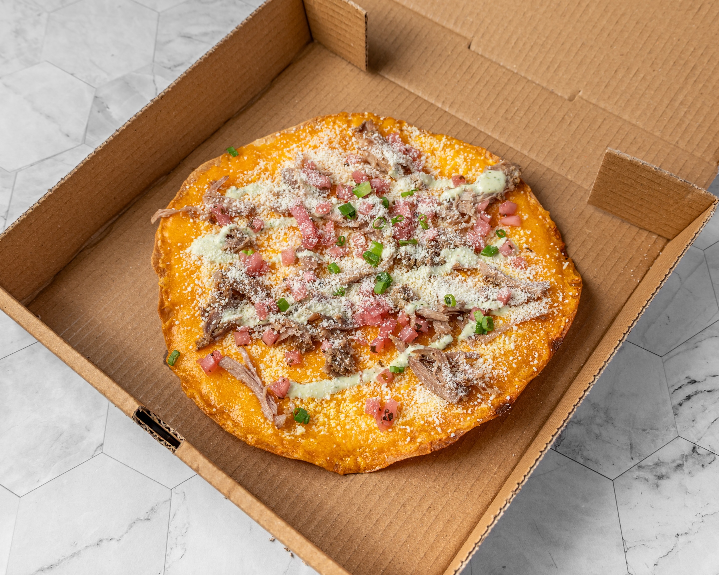 Arizona cheese crisp — flour tortilla with melted cheese and roasted green chile